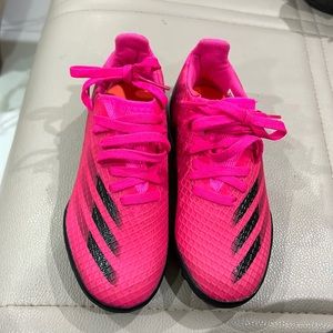 Hot pink and black soccer shoes. Male/Boys size 12